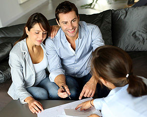 Couple meeting adviser for property purchase